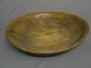 An antique circular wooden dish (split and repaired) 18"