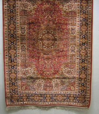 A Persian design Belgian cotton carpet with orange ground 90" x 59"