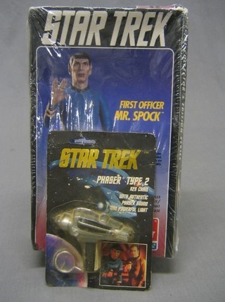 A Star Trek figure of First Officer Mr Spock together with a Star Trek faser type II key ring