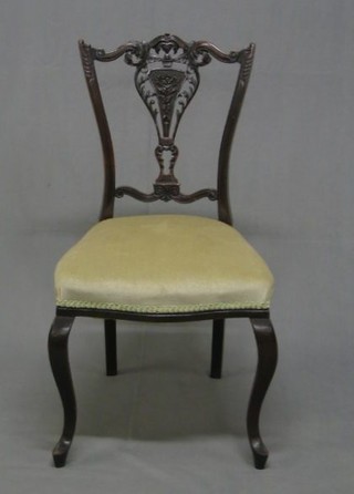 An Edwardian mahogany salon suite comprising open arm carver chair and 4 standard chairs