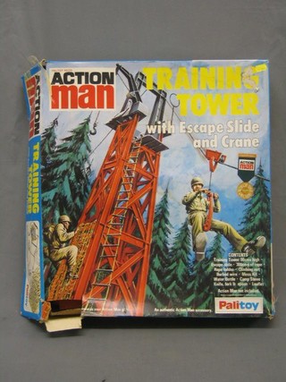 An Action Man training tower with escape slide and crane, boxed