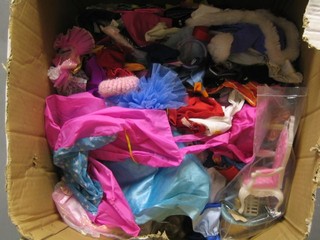 A large collection of various Barbie doll clothing etc