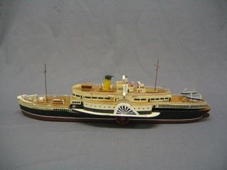 A motor operated model of a paddle steamer 29"