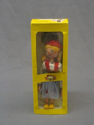 A Pelham puppet of a blonde girl with plaits, boxed