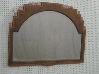 An Art Deco arch shaped bevelled plate wall mirror contained in an inlaid mahogany frame 33"