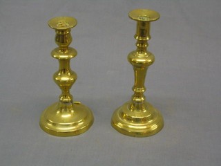 A 19th Century brass candlestick with ejector and 1 other