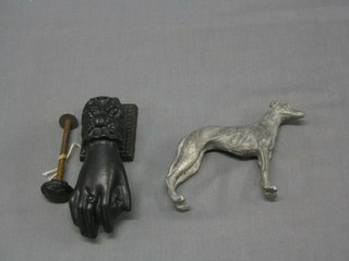 A Victorian cast iron door knocker in the form of a clasped hand with apple, the reverse marked 12CFL together with a pewter model of a greyhound 4"
