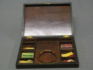 A 19th Century mahogany games box with fitted interior and various game counters 12"