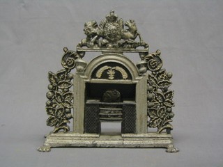 A Victorian miniature cast iron ducks nest fire grate, surmounted by Royal Coat of Arms 12"