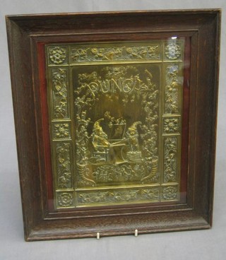 A 19th Century embossed brass Punch book cover, decorated a seated Mr Punch 11" x 8"