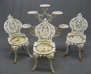 A set of 3 Victorian pierced cast iron garden seats (1 cracked)