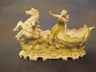 A 19th Century German porcelain boat shaped vase in the form of a chariot with figure 14" (f and r)