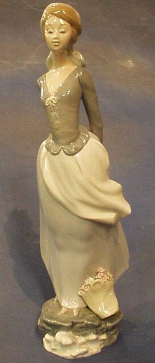A Lladro figure of a standing lady, base incised N24MY, 14"