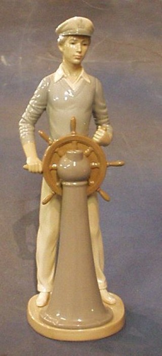 A Lladro figure of a helmsman, base marked H12E1983 13"
