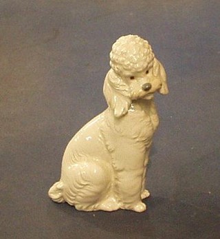 A Nao  figure of a seated white poodle, base marked Nao B159, 7"