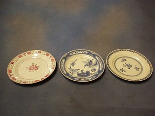 A 19th Century famille rose porcelain plate 9" and 2 Oriental blue and white porcelain plates (cracked)