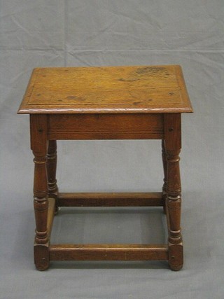 A Victorian honey oak rectangular joined stool, raised on turned and block supports 16"
