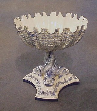 A 19th Century Royal Worcester porcelain scallop shape bowl, supported by dolphins, raised on a triform base, incised 317 and impressed Worcester mark (some chips to rim) 7"