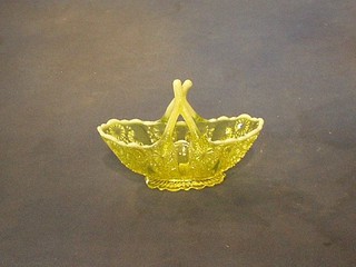 A Vaseline glass boat shaped basket 6"