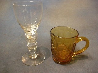 A George VI Coronation amber glass half pint tankard, a wine glass set a 1935 sixpence