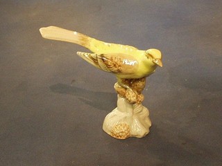 A Royal Dux figure of a seated yellow bird the base with pink Royal Dux triangular mark 0221 6"
