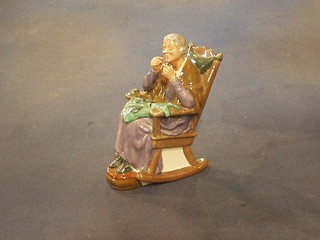 A Royal Doulton figure A Stitch in Time HN2352