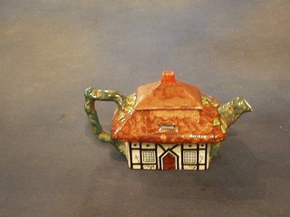A Maddock Pottery teapot in the form of a cottage