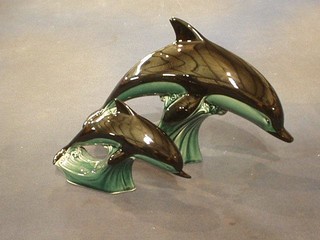 A pair of Poole Pottery figures of dolphins 11" and 6"