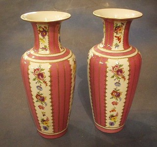 A pair of Victorian style porcelain vases of club form with pink and floral panels and gilt banding 14"