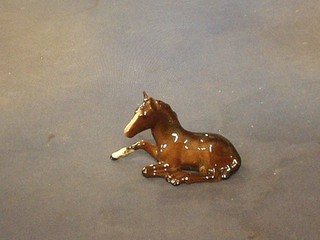 A Beswick figure of a seated foal 4"