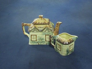 A Cottageware teapot and cream jug