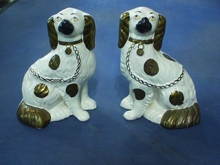 A pair of Staffordshire figures of seated dogs 9"