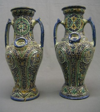 A pair of pottery twin handled vases 21"
