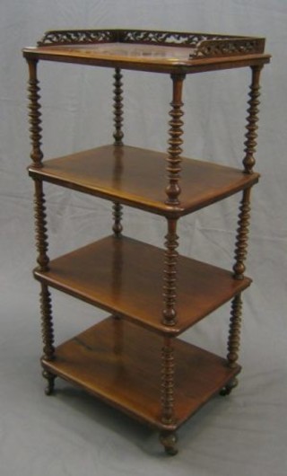 A Victorian rosewood 4 tier what-not with pierced three-quarter gallery raised on bobbin turned supports 24"