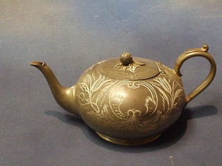 An engraved Britannia metal teapot by W E Wood