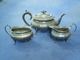 A 3 piece silver plated tea service of oval form comprising teapot, twin handled sugar bowl and cream jug