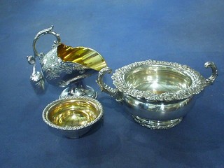 A heavy Victorian circular silver plated twin handled sugar bowl, silver plated sugar scuttle and a wine funnel (f)