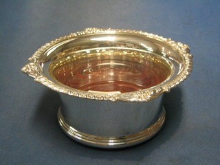 A modern silver coaster with gadrooned border, marked Sheffield  8"