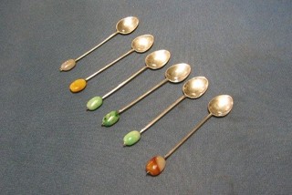 A set of 6 unmarked silver coffee spoons with hardstone beans to the ends