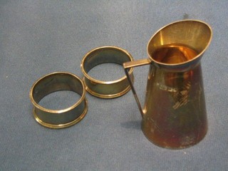 A Victorian silver cream jug Sheffield 1890 and 2 silver napkin rings