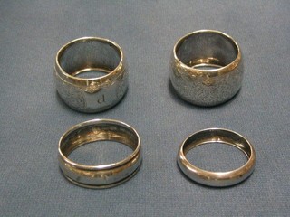 2 pairs of silver napkin rings