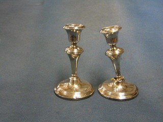 A pair of silver candlesticks engraved decoration 5" (1f), Birmingham 1917