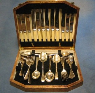 A canteen of silver plated Old English flatware contained in a walnut canteen box