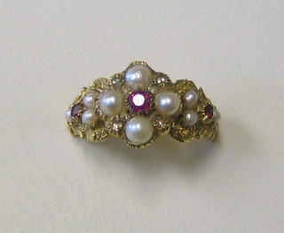A lady's Victorian style gold dress ring set 3 rubies supported by 10 demi-pearls