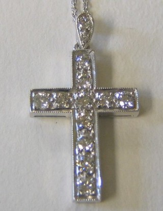 A lady's 18ct white gold cross set 12 diamonds, hung on a fine gold chain (approx 0.88ct)