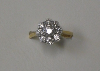 A lady's 18ct gold floral design dress ring set 9 diamonds (approx 1.01ct)