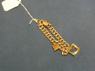 A modern  hollow gold curb link charm bracelet hung 2 charms