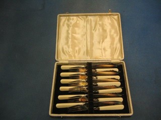 A set of 6 silver plated fish knives and forks
