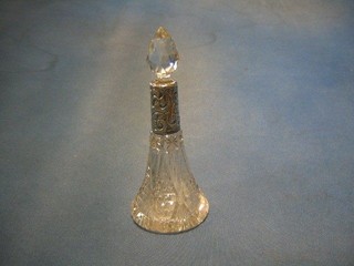 A tapered cut glass perfume bottle with embossed silver collar
