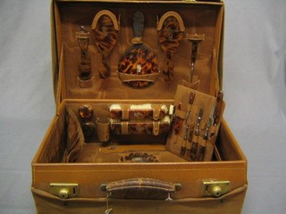 A lady's vanity case fitted various tortoiseshell backed brushes etc